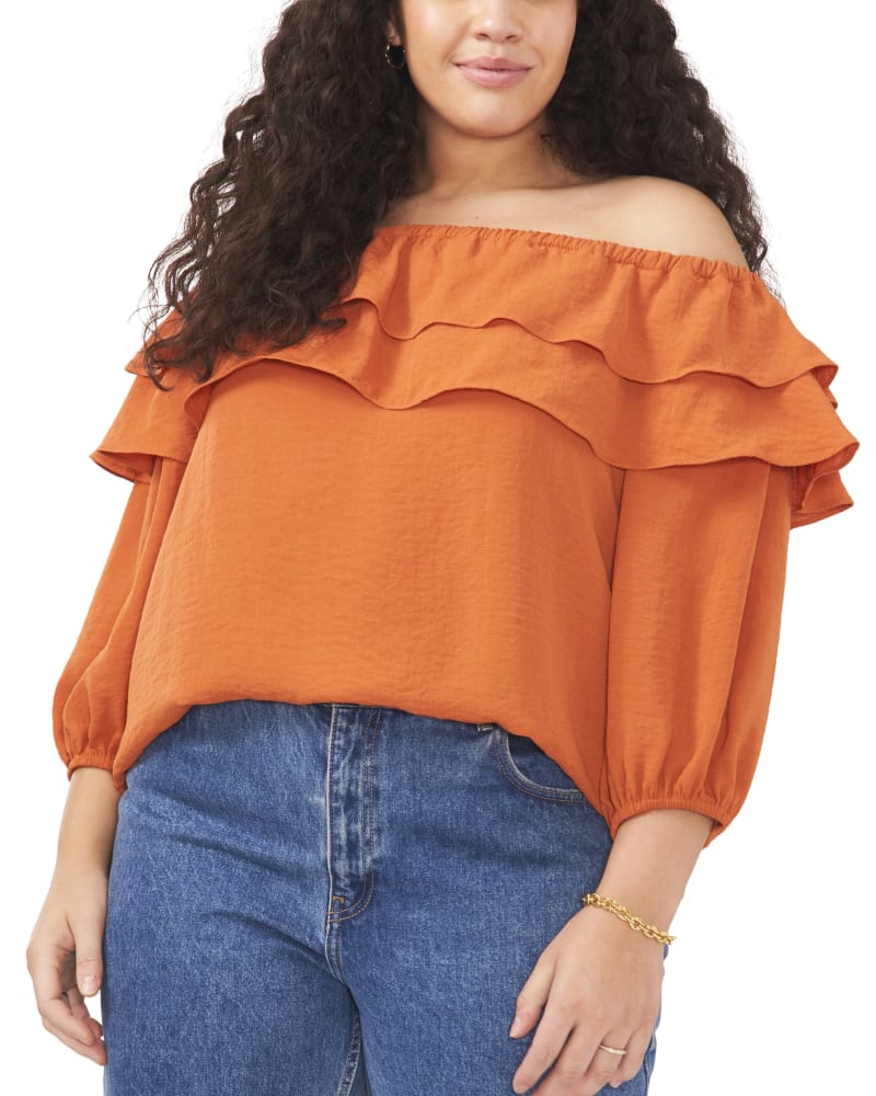 Front of a model wearing a size 1X Brenna Off the Shoulder Blouse in CITRUS SPICE by Vince Camuto. | dia_product_style_image_id:261675